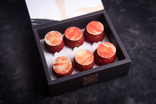 A box of Strawberry Cheesecake Craquelins with the crackers visible through the transparent lid.