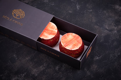 Strawberry Cheesecake Craquelin in a small box.