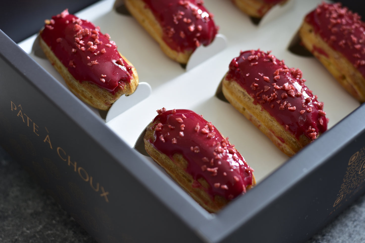 A box of Strawberry Mini Eclairs.